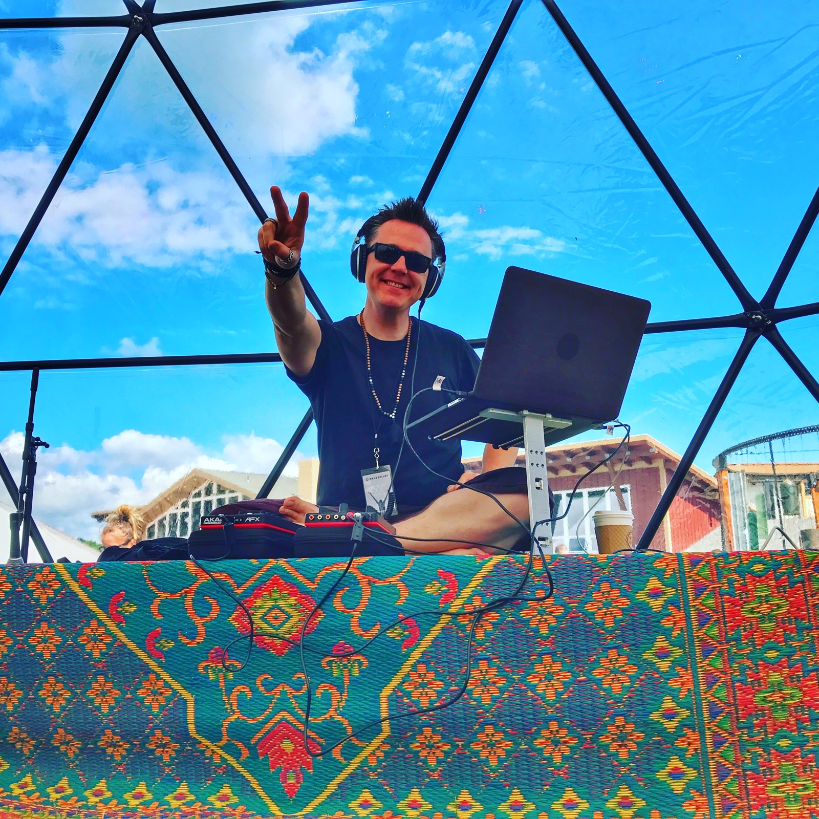 DJ Zack Darling performing beneath a geodesic dome at Wanderlust Festival